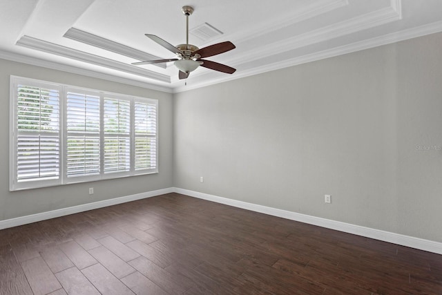 27455 Mistflower Dr, Wesley Chapel, FL 33544 - unfurnished room with a raised ceiling, a ceiling fan, crown molding, and dark wood-style flooring