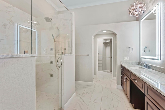 27455 Mistflower Dr, Wesley Chapel, FL 33544 - full bath with marble finish floors, a marble finish shower, vanity, and a spacious closet