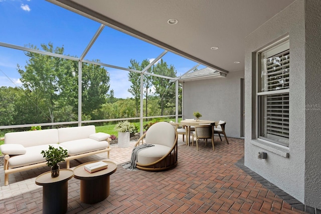 27455 Mistflower Dr, Wesley Chapel, FL 33544 - view of patio / terrace featuring outdoor dining area, a lanai, and an outdoor living space