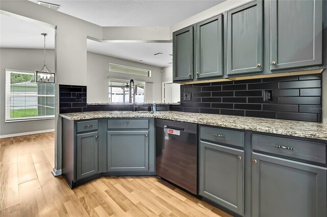 19635 Bellehurst Loop, Land O Lakes, FL 34638 - kitchen featuring dishwasher, backsplash, healthy amount of natural light, and light stone countertops