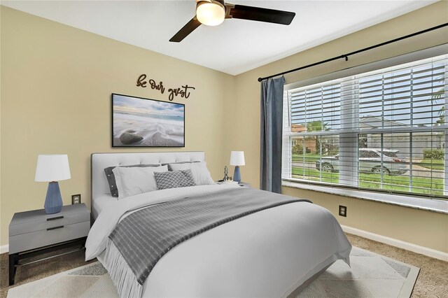 19635 Bellehurst Loop, Land O Lakes, FL 34638 - carpeted bedroom with baseboards and ceiling fan
