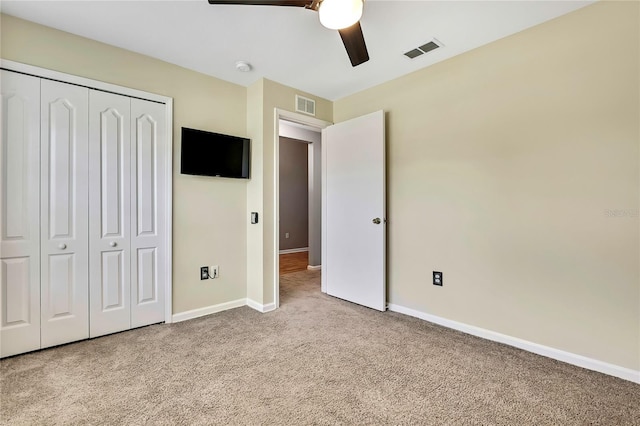 19635 Bellehurst Loop, Land O Lakes, FL 34638 - unfurnished bedroom with carpet floors, a closet, and a ceiling fan