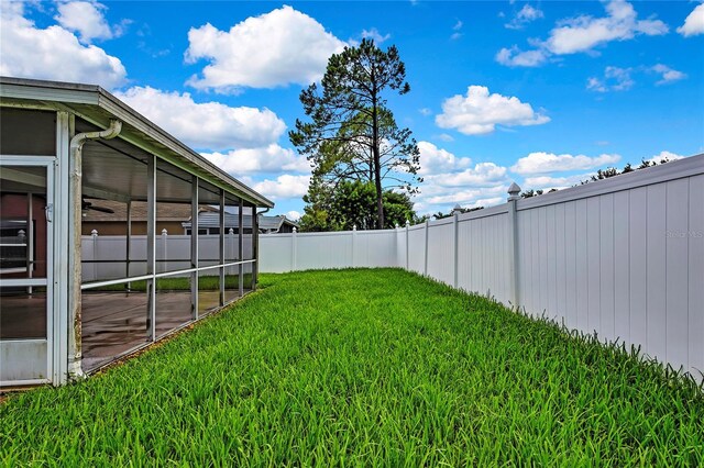 19635 Bellehurst Loop, Land O Lakes, FL 34638 - fenced backyard featuring a sunroom
