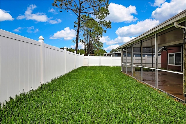 19635 Bellehurst Loop, Land O Lakes, FL 34638 - fenced backyard featuring a sunroom and a ceiling fan