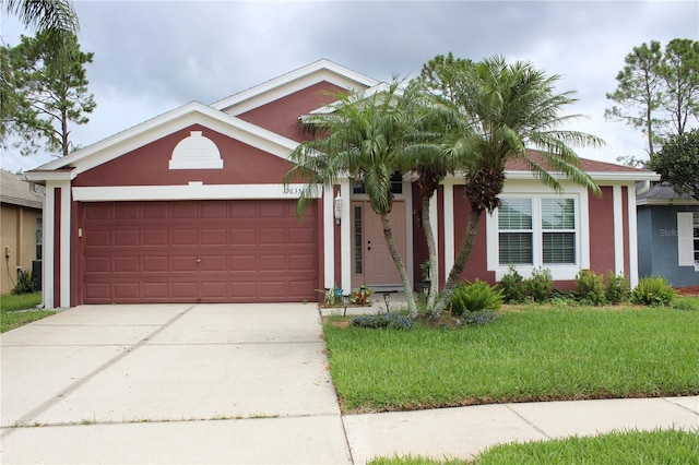 19635 Bellehurst Loop, Land O Lakes, FL 34638 - ranch-style home featuring stucco siding, an attached garage, driveway, and a front lawn