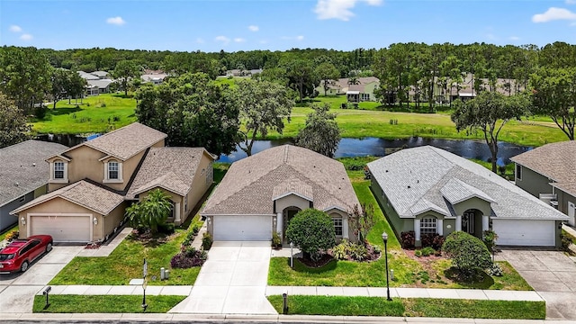 11348 Tee Time Cir, New Port Richey, FL 34654 - aerial perspective of suburban area featuring a nearby body of water and a tree filled landscape
