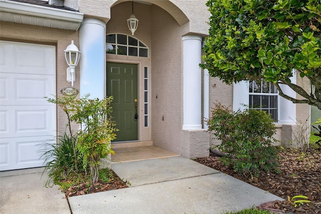 11348 Tee Time Cir, New Port Richey, FL 34654 - entrance to property with stucco siding and an attached garage