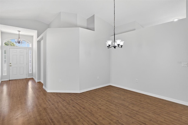 11348 Tee Time Cir, New Port Richey, FL 34654 - foyer entrance with a chandelier, dark wood-type flooring, and lofted ceiling