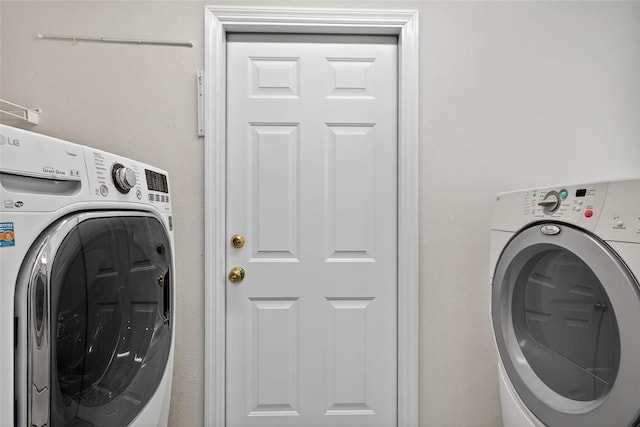 11348 Tee Time Cir, New Port Richey, FL 34654 - laundry area with washer / clothes dryer