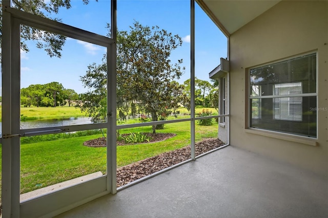 11348 Tee Time Cir, New Port Richey, FL 34654 - unfurnished sunroom with a water view, healthy amount of natural light, and view of scattered trees