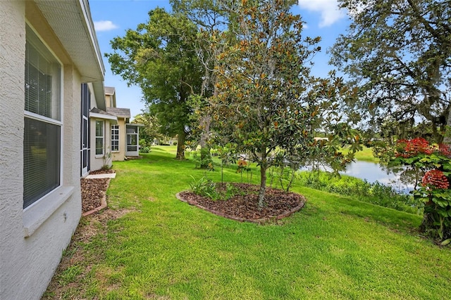 11348 Tee Time Cir, New Port Richey, FL 34654 - view of green lawn featuring a water view