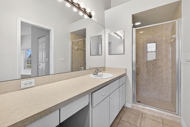 11348 Tee Time Cir, New Port Richey, FL 34654 - bathroom featuring vanity, a stall shower, and tile patterned floors