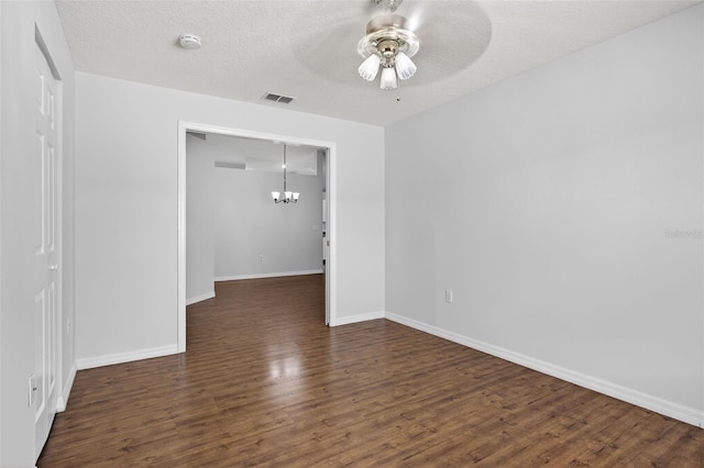 11348 Tee Time Cir, New Port Richey, FL 34654 - spare room with a ceiling fan, a chandelier, a smoke detector, and wood finished floors