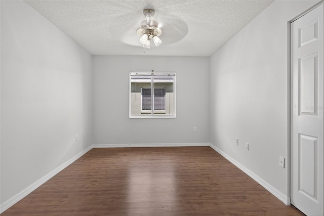 11348 Tee Time Cir, New Port Richey, FL 34654 - empty room with wood finished floors, ceiling fan, and a textured ceiling
