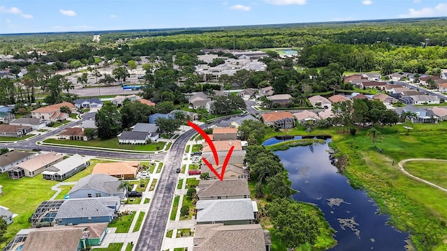 11348 Tee Time Cir, New Port Richey, FL 34654 - aerial overview of property's location with a large body of water and nearby suburban area