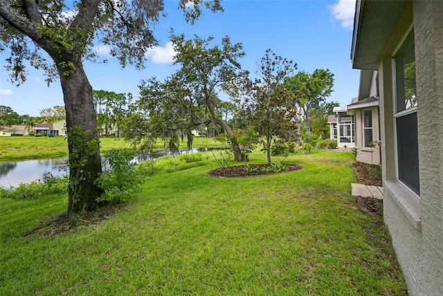 11348 Tee Time Cir, New Port Richey, FL 34654 - view of grassy yard with a water view