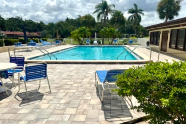 1701 Pinehurst Rd Unit 24B, Dunedin, FL 34698 - community pool featuring a patio area