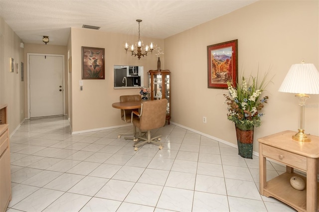 1701 Pinehurst Rd Unit 24B, Dunedin, FL 34698 - dining space featuring a chandelier and light tile patterned flooring