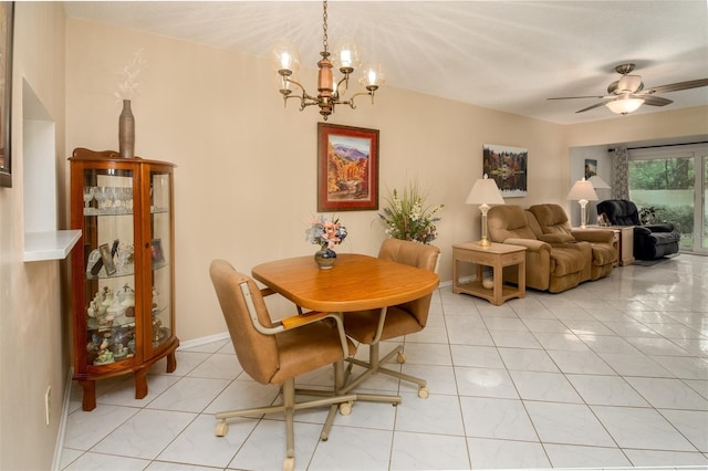 1701 Pinehurst Rd Unit 24B, Dunedin, FL 34698 - dining area featuring light tile patterned floors, a chandelier, and ceiling fan