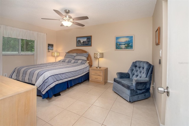 1701 Pinehurst Rd Unit 24B, Dunedin, FL 34698 - bedroom featuring light tile patterned floors, ceiling fan, and a textured ceiling
