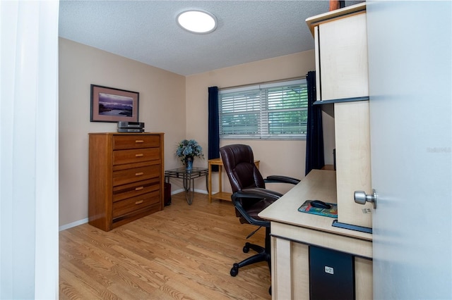 1701 Pinehurst Rd Unit 24B, Dunedin, FL 34698 - home office featuring a textured ceiling and light wood-type flooring