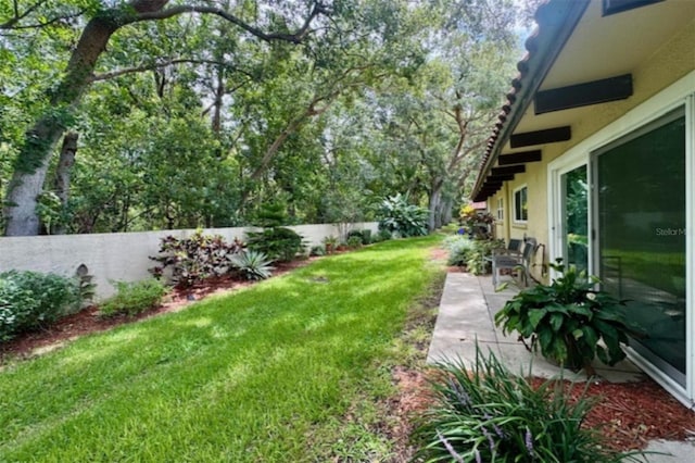 1701 Pinehurst Rd Unit 24B, Dunedin, FL 34698 - fenced backyard with a patio area
