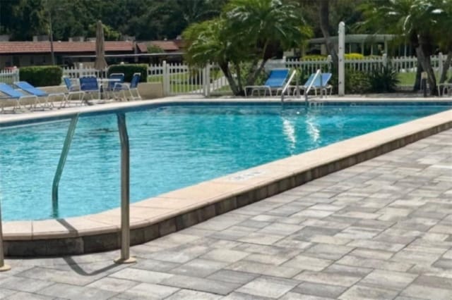 1701 Pinehurst Rd Unit 24B, Dunedin, FL 34698 - community pool with a patio area