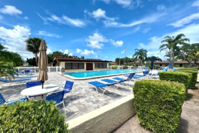 1701 Pinehurst Rd Unit 24B, Dunedin, FL 34698 - community pool featuring a patio