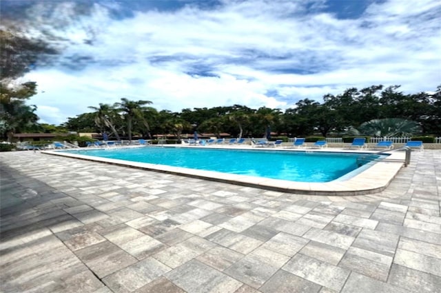 1701 Pinehurst Rd Unit 24B, Dunedin, FL 34698 - community pool with a patio area