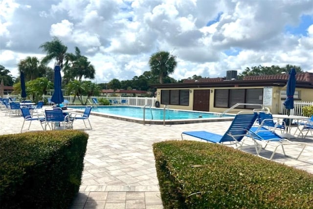 1701 Pinehurst Rd Unit 24B, Dunedin, FL 34698 - community pool featuring a patio