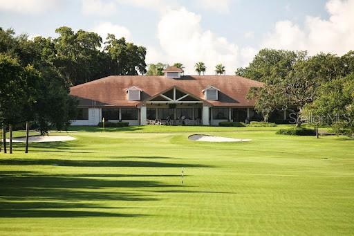 1701 Pinehurst Rd Unit 24B, Dunedin, FL 34698 - view of home's community with a lawn and view of golf course
