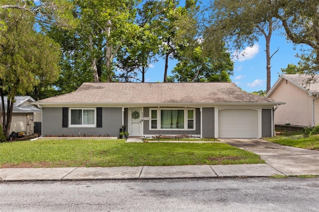 8004 Beaver Creek Loop, Hudson, FL 34667 - ranch-style house featuring a garage, concrete driveway, a front lawn, and brick siding