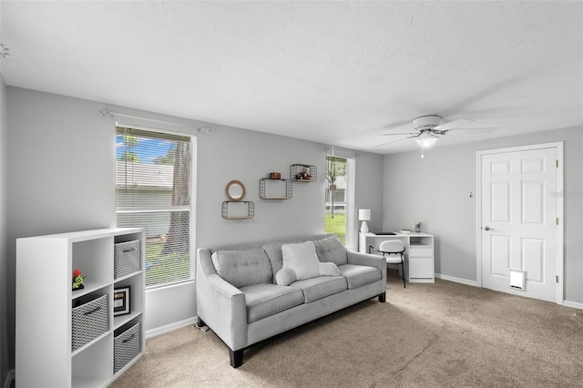 8004 Beaver Creek Loop, Hudson, FL 34667 - living room with carpet flooring, ceiling fan, and a textured ceiling