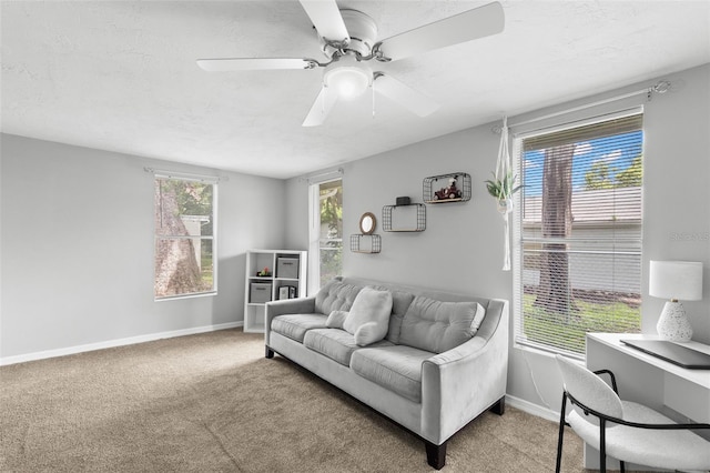8004 Beaver Creek Loop, Hudson, FL 34667 - living room with light colored carpet, ceiling fan, and a desk
