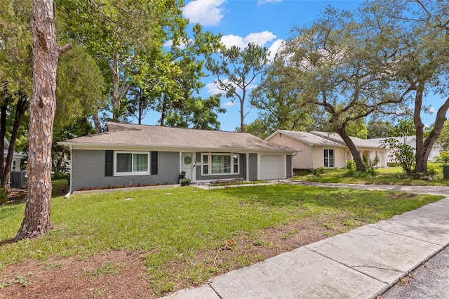 8004 Beaver Creek Loop, Hudson, FL 34667 - single story home featuring a garage, driveway, a front yard, and brick siding