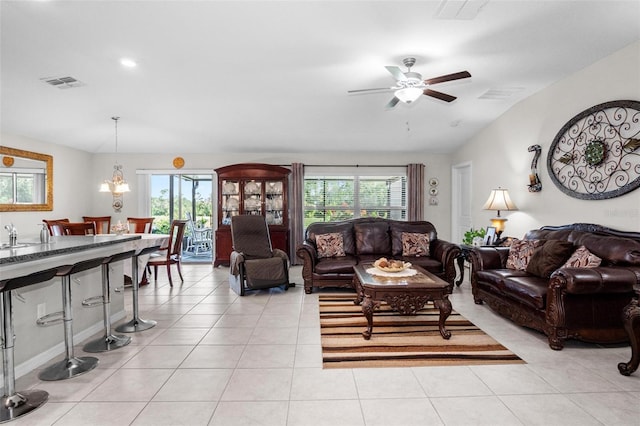 11303 Misty Moss Dr, Wimauma, FL 33598 - living area with healthy amount of natural light, a ceiling fan, lofted ceiling, and light tile patterned floors