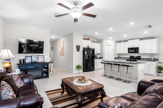 11303 Misty Moss Dr, Wimauma, FL 33598 - living room with ceiling fan, light tile patterned flooring, and recessed lighting