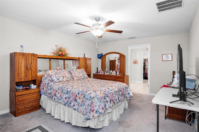 11303 Misty Moss Dr, Wimauma, FL 33598 - bedroom with light carpet and ceiling fan