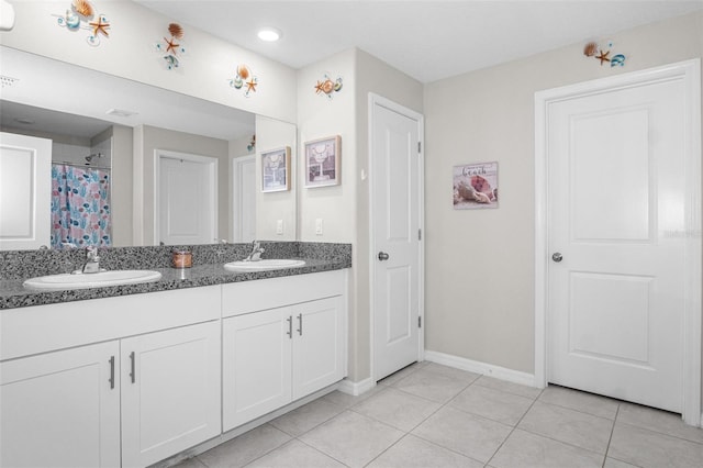 11303 Misty Moss Dr, Wimauma, FL 33598 - bathroom featuring double vanity, tile patterned floors, and recessed lighting