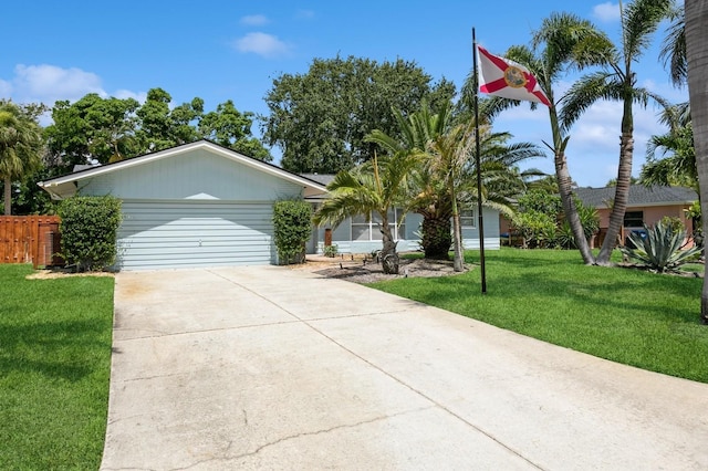 1304 63rd St NW, Bradenton, FL 34209 - view of front facade with driveway and an attached garage