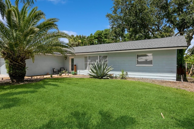 1304 63rd St NW, Bradenton, FL 34209 - view of front of home with a front lawn and roof with shingles