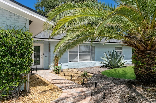 1304 63rd St NW, Bradenton, FL 34209 - view of exterior entry featuring brick siding