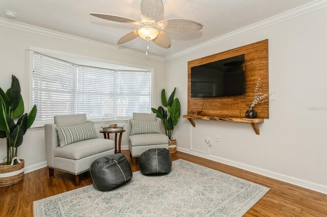 1304 63rd St NW, Bradenton, FL 34209 - living area featuring a ceiling fan, ornamental molding, and wood finished floors