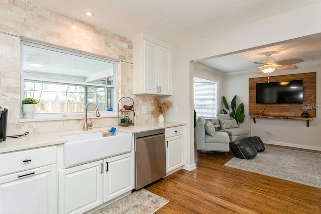 1304 63rd St NW, Bradenton, FL 34209 - kitchen with dishwasher, open floor plan, decorative backsplash, healthy amount of natural light, and ornamental molding