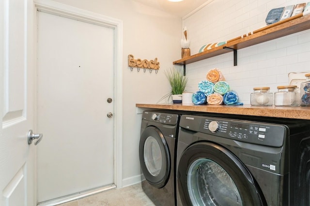 1304 63rd St NW, Bradenton, FL 34209 - laundry room featuring washer and clothes dryer and light tile patterned floors
