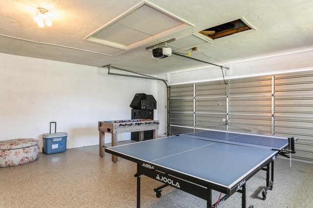 1304 63rd St NW, Bradenton, FL 34209 - rec room with speckle patterned floor and a garage