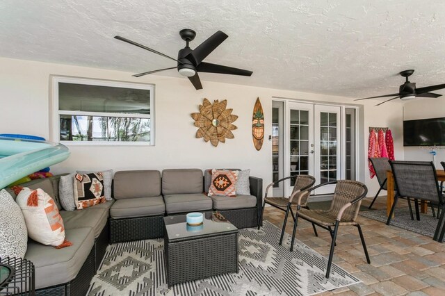 1304 63rd St NW, Bradenton, FL 34209 - view of patio / terrace with french doors, ceiling fan, and an outdoor living space