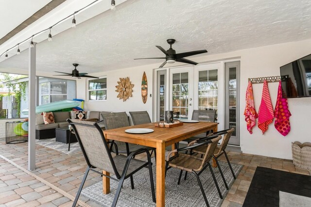 1304 63rd St NW, Bradenton, FL 34209 - view of patio / terrace featuring ceiling fan, outdoor dining area, and french doors
