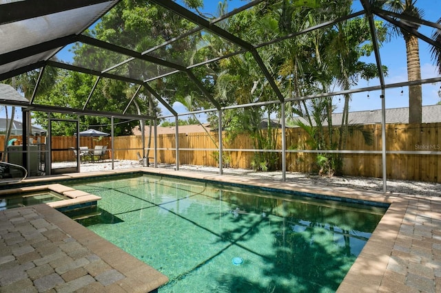 1304 63rd St NW, Bradenton, FL 34209 - view of pool with a fenced backyard, a patio, a lanai, and a pool with connected hot tub