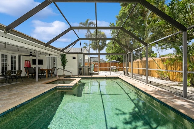 1304 63rd St NW, Bradenton, FL 34209 - view of swimming pool with french doors, a fenced backyard, a patio area, and glass enclosure
